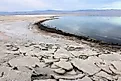 Salt crusts on a receded shoreline during a drought, taken at the Salton Sea in Salton City, California.