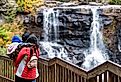 Tourists admiring the beautiful Blackwater Falls in Davis, West Virginia.