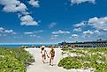 Girls walking on Folly Beach. South Carolina.