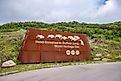 Entrance signage for the Head-Smashed-In Buffalo Jump World Heritage Site, via Jeff Whyte / Shutterstock.com