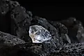 Natural rough diamonds on a pile of rocs close up photography.