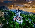 Neuschwanstein Castle in front of the mountain landscape near Füssen in the Allgäu. 
