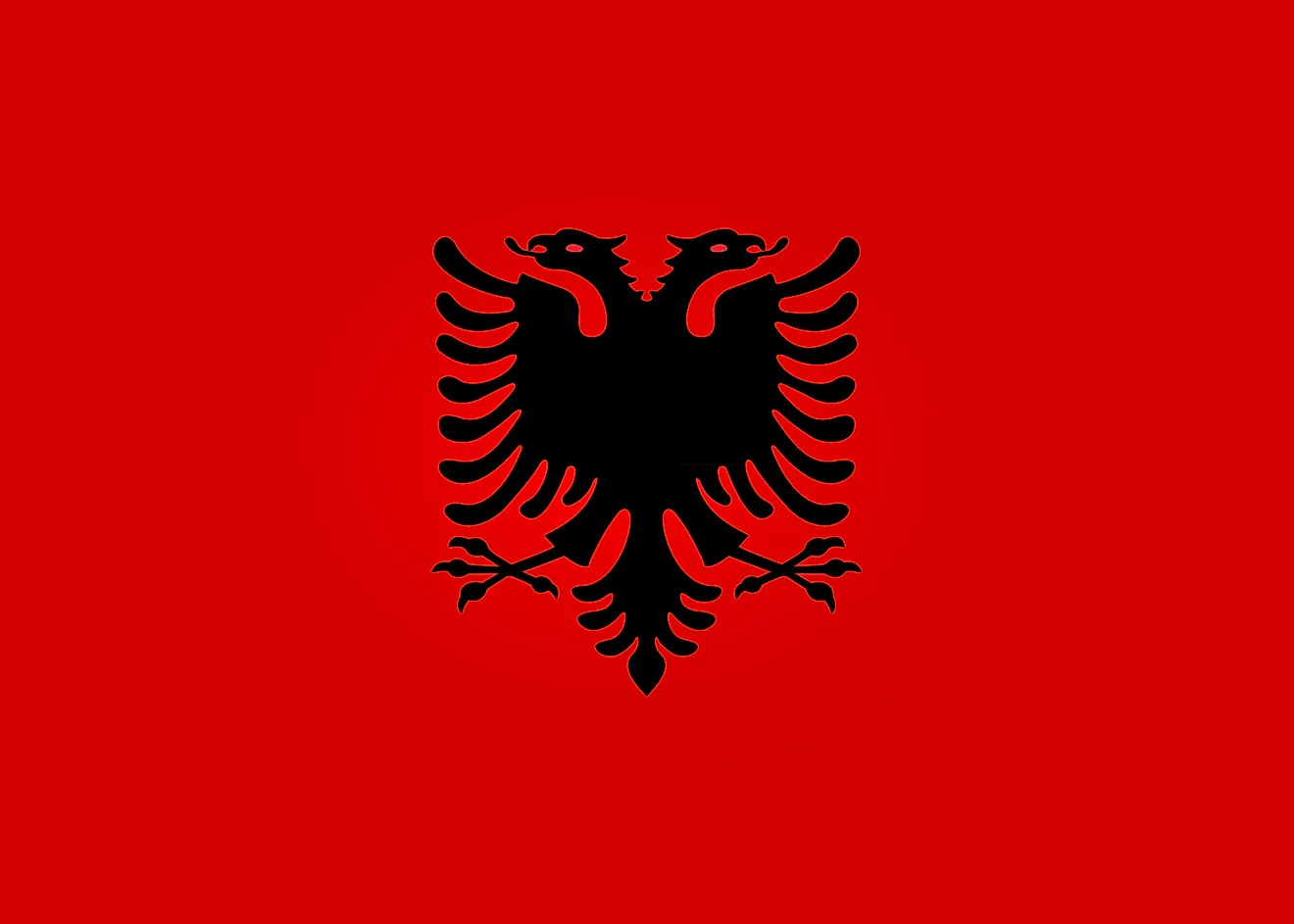 The National Flag of Albania - Flamuri Kombëtar  features a red background with a double-headed eagle placed in the center.