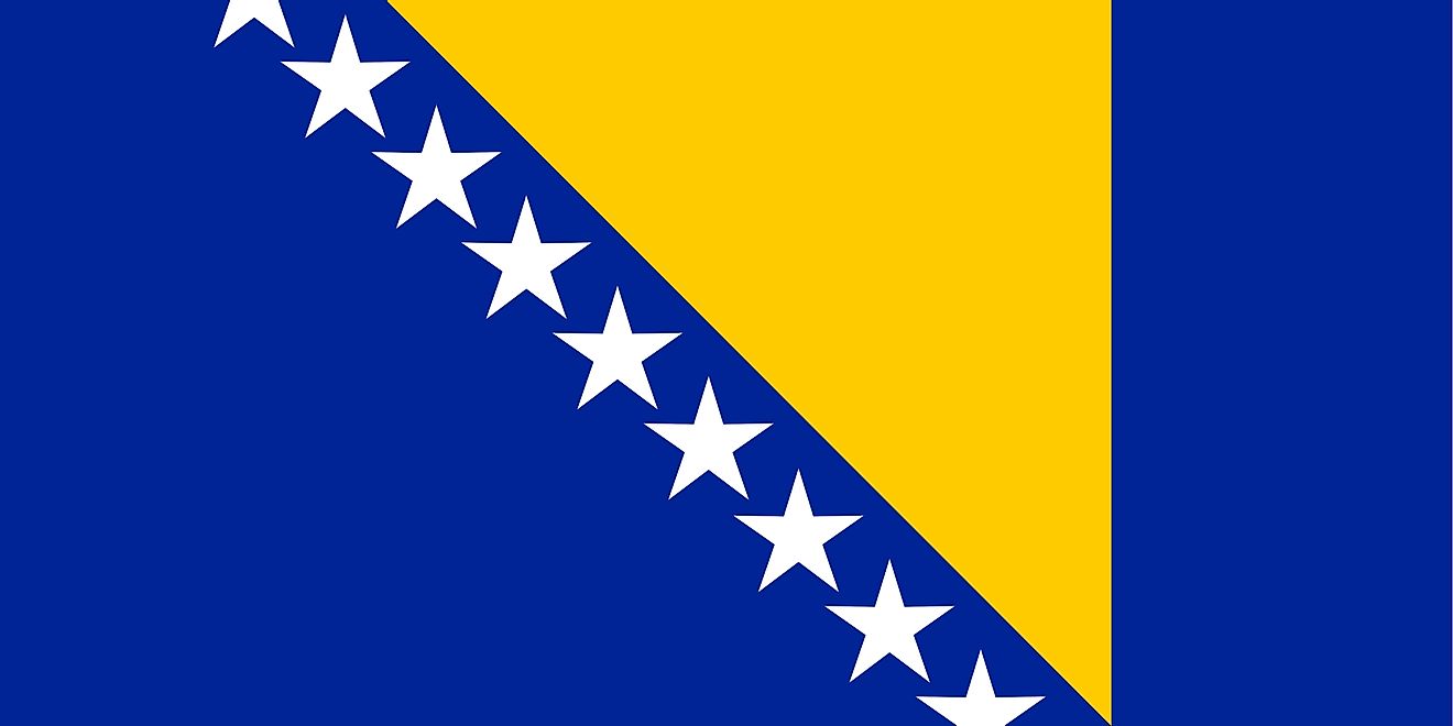 The Bosnia and Herzegovina flag features a wide blue vertical band on the fly side with a yellow isosceles triangle abutting the band and the top of the flag.