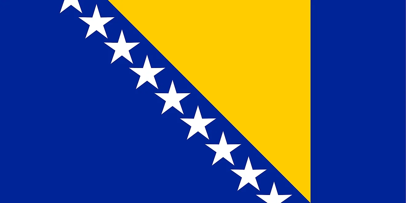 The Bosnia and Herzegovina flag features a wide blue vertical band on the fly side with a yellow isosceles triangle abutting the band and the top of the flag.