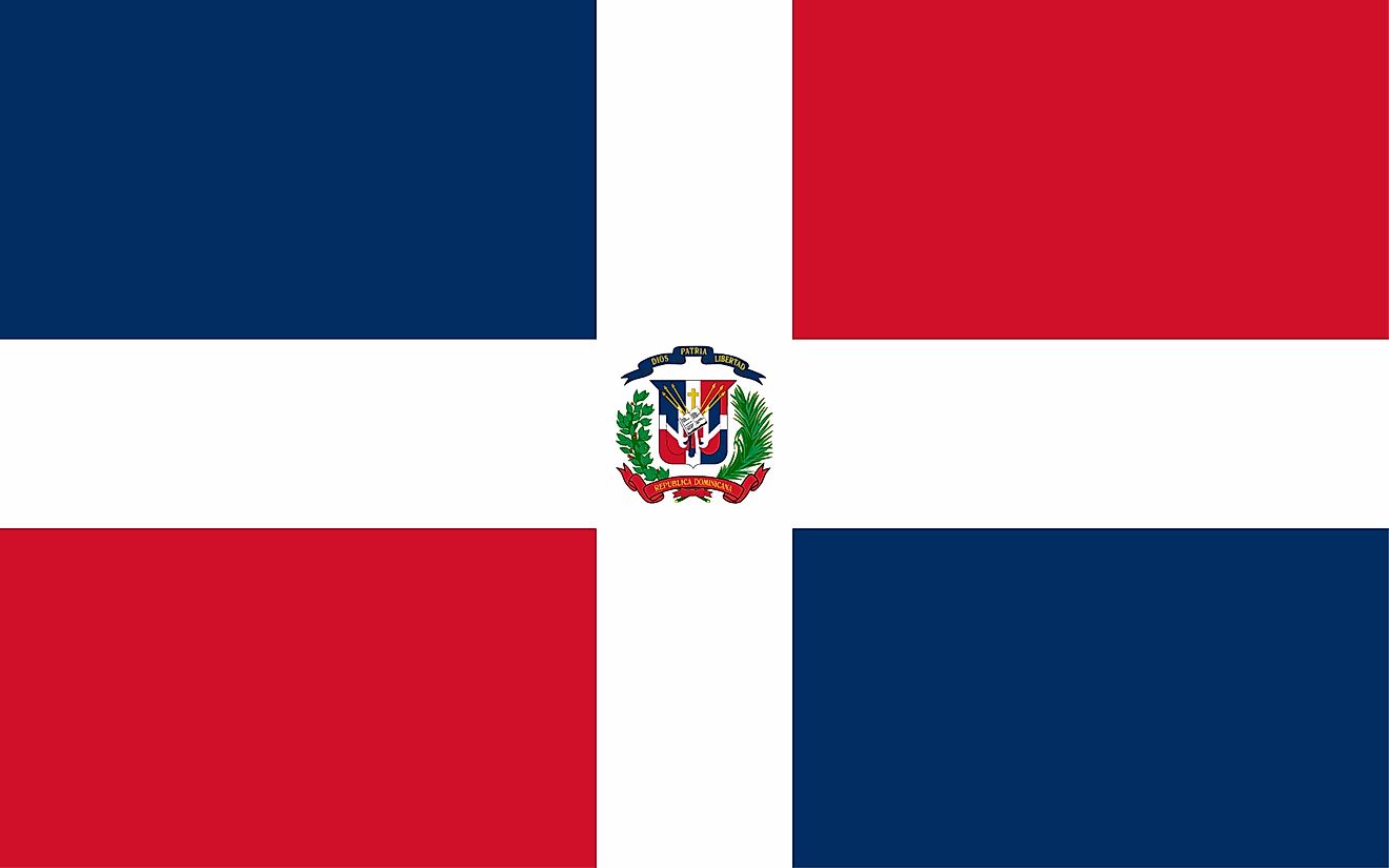 The National Flag of The Dominican Republic comprises a centered white cross that extends to the edges and divides the flag into four rectangles of blue and red.