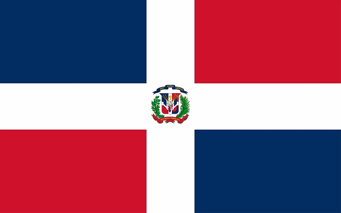 The National Flag of The Dominican Republic comprises a centered white cross that extends to the edges and divides the flag into four rectangles of blue and red.