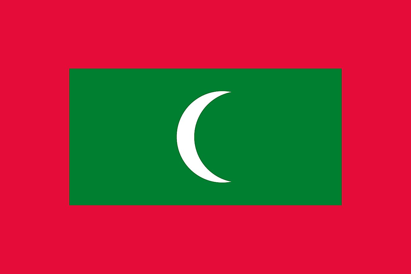 The flag of Maldives consists of a red field with a large green rectangle in the middle bearing a vertical white crescent moon whose closed side faces the hoist side