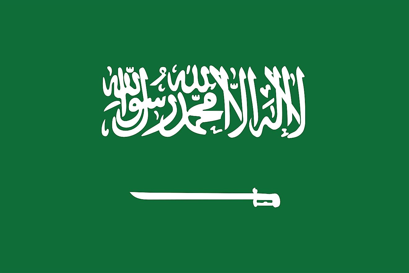 The National Flag of Saudi Arabia features a green background with the Shahada or Muslim creed in large white Thuluth script, placed above a white horizontal sword, whose tip points to the hoist side of the flag. 