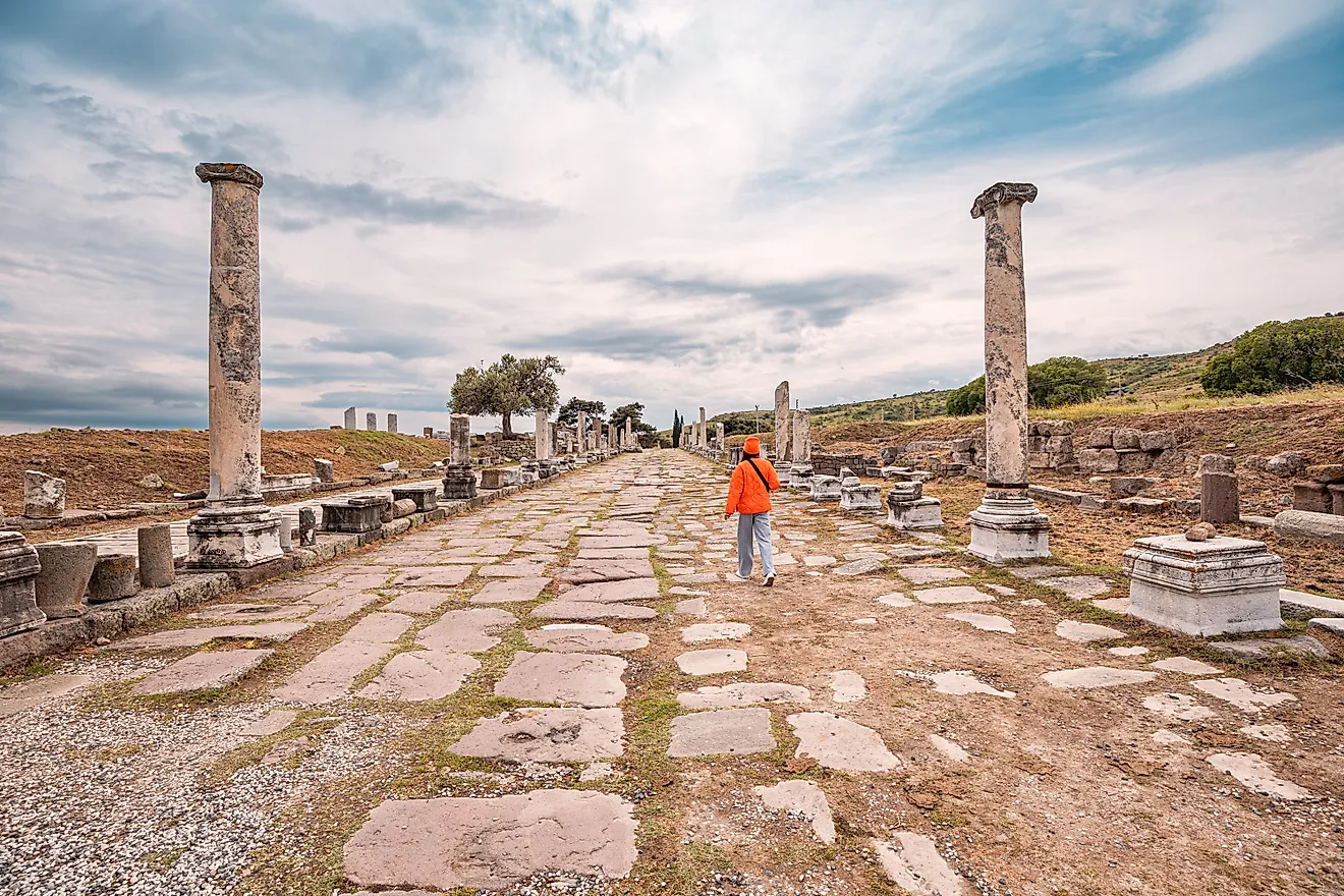 Tourist walking down an Ancient Roman road.