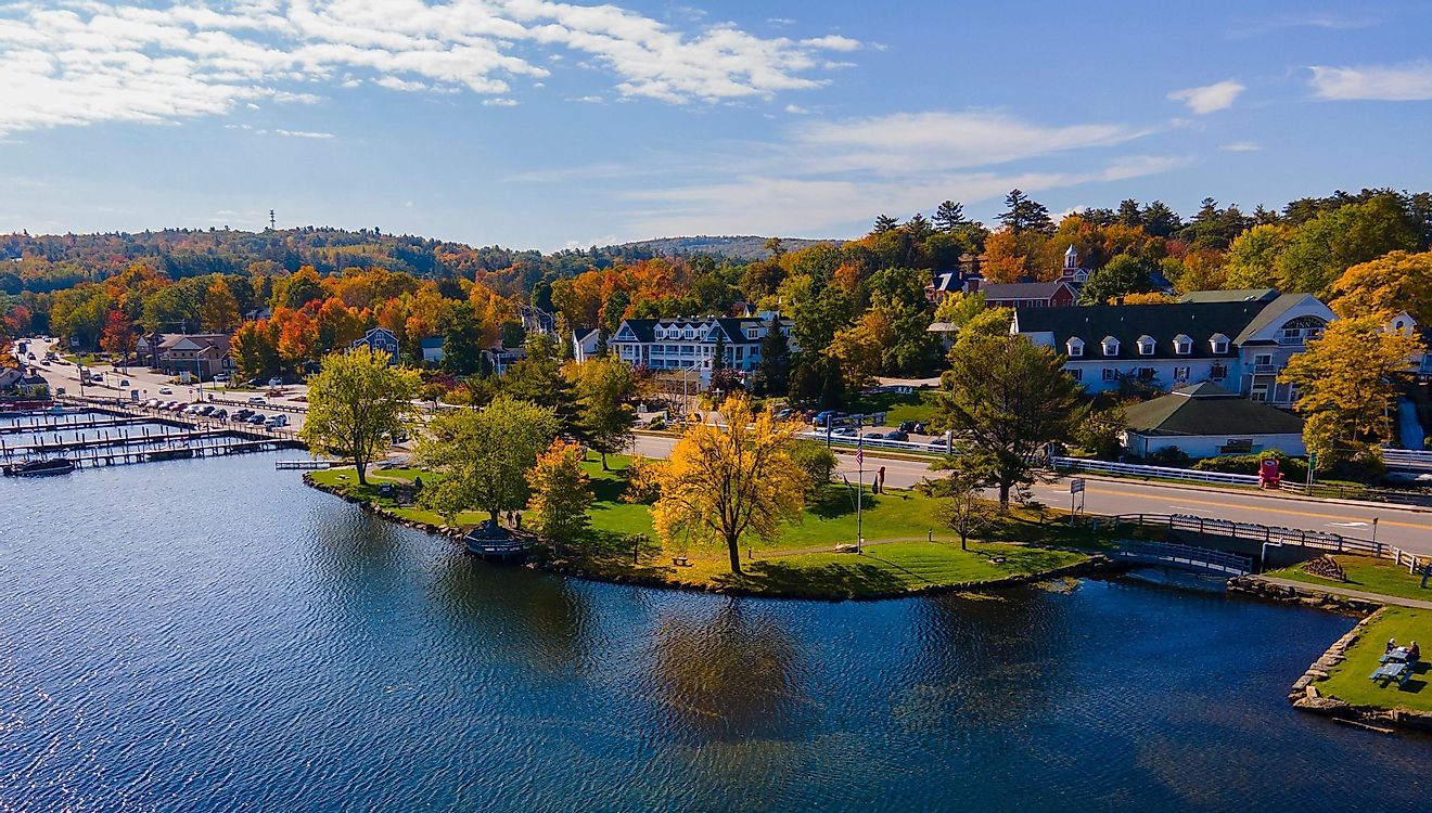 Waterfront of Meredith Bay in Lake Winnipesaukee at Meredith town center aerial view with fall foliage, New Hampshire