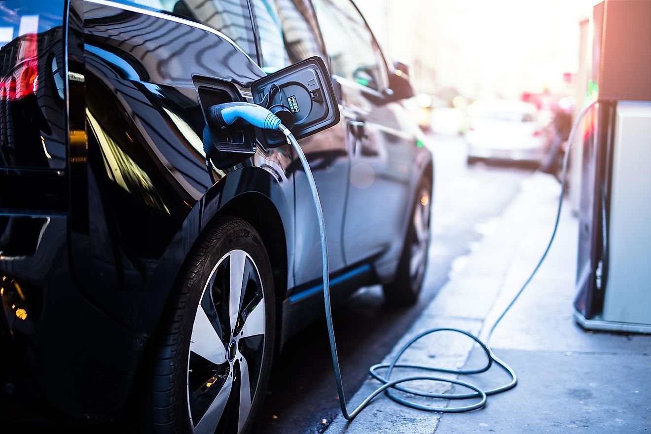 Charging modern electric car on the street which are the future of the Automobile. Image credit: Guteksk7/Shutterstock.com