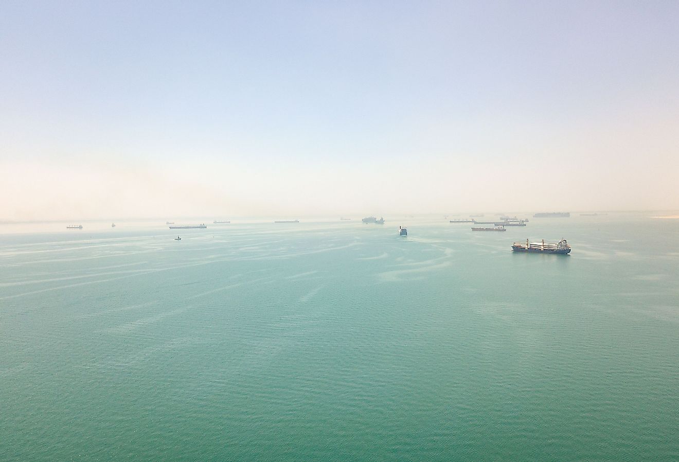 View of ships at anchor in the Great Bitter Lake at the halfway point of the Suez Canal. Image credit FabianIrwin via Shutterstock.