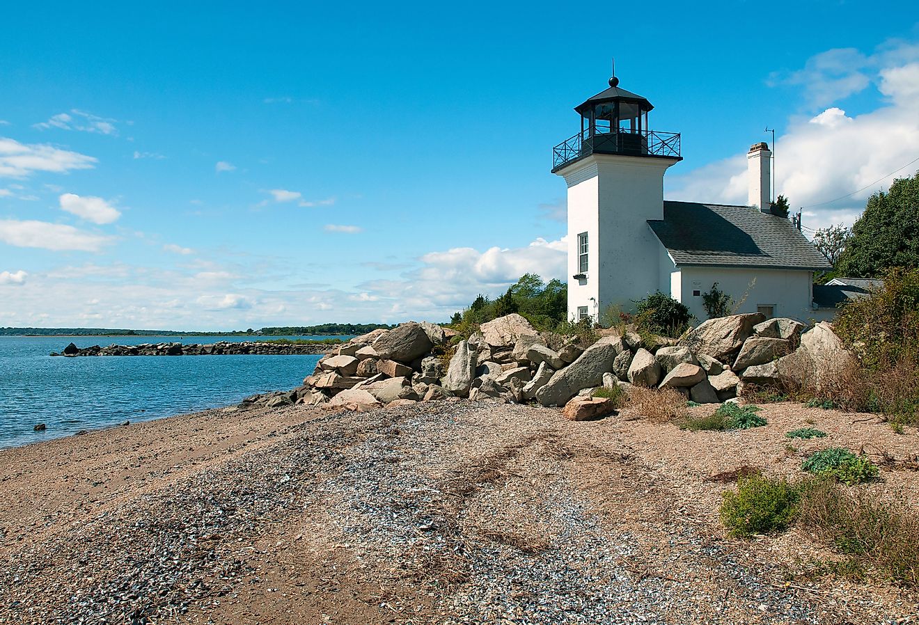 Bristol Ferry lighthouse is surrounded with large boulders to protect the keepers when the tides would rise in Narragansett Bay in Rhode Island.