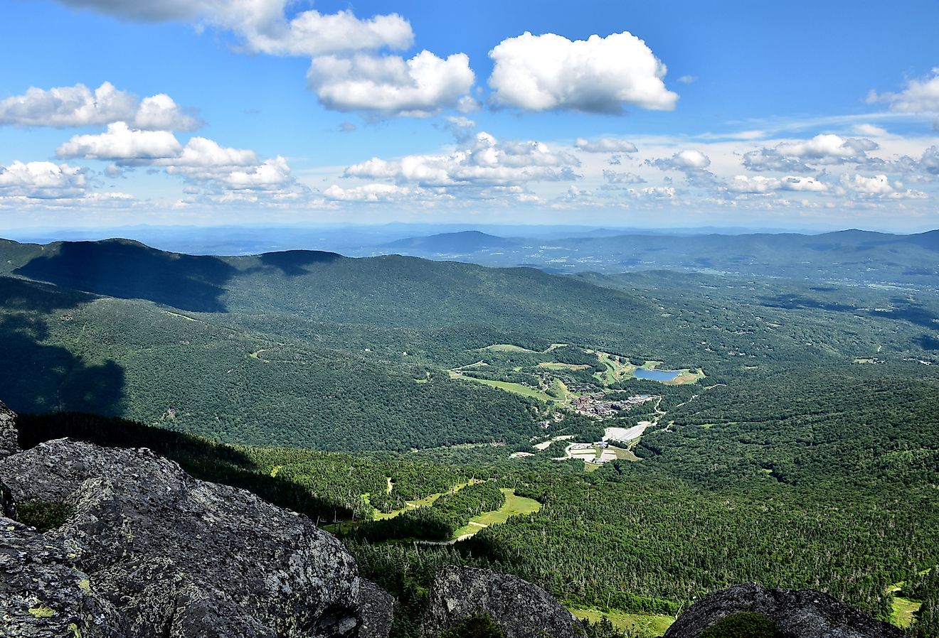 Scenic mountain views while hiking the Long Trail in Stowe, Vermont in summer. Image credit Monika Salvan via Shutterstock.