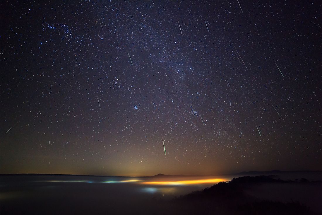Geminid Meteor in the night sky and fog at Khao Takhian Ngo View Point at Khao-kho Phetchabun,Thailand.