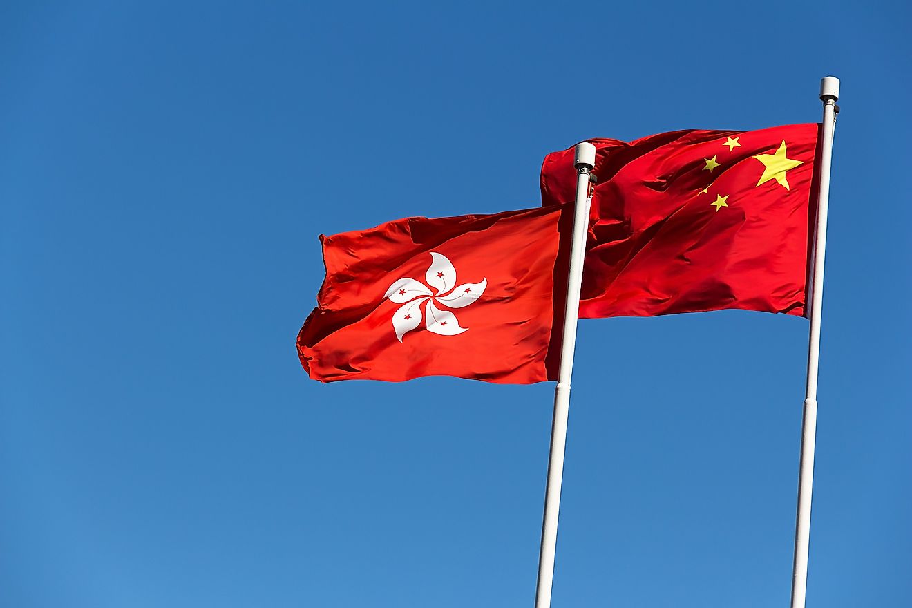 Flags of Hong Kong and China. Image credit: Daniel Fung/Shutterstock.com