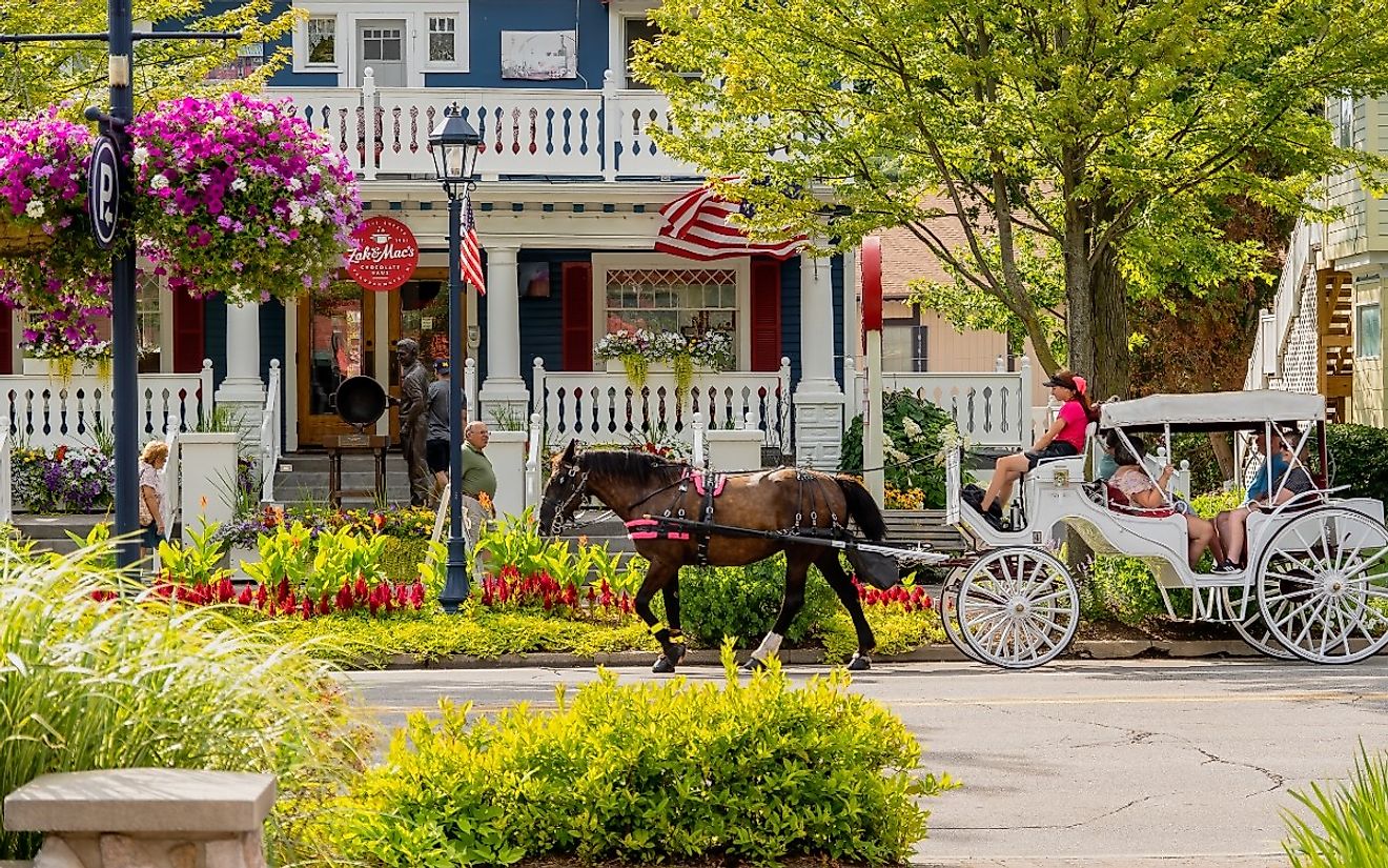 A horse-drawn carriage transports tourists in downtown Frankenmuth, Michigan. Image credit arthurgphotography via Shutterstock