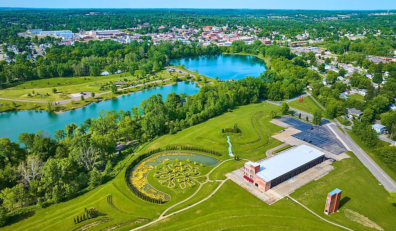 Turquoise pond water in distant summertime aerial over Mount Vernon and Ariel Foundation Park
