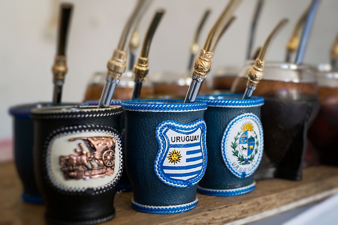Cups used for drinking mate, a type of tea popular in Uruguay, are pictured here featuring the flag of Uruguay. 