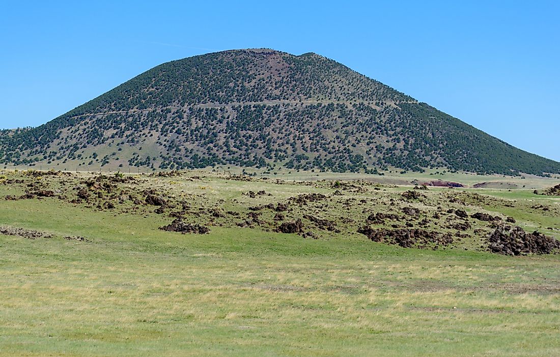 The immense height of the extinct Capulin Volcano contrasts the flat plains that surround the area. 