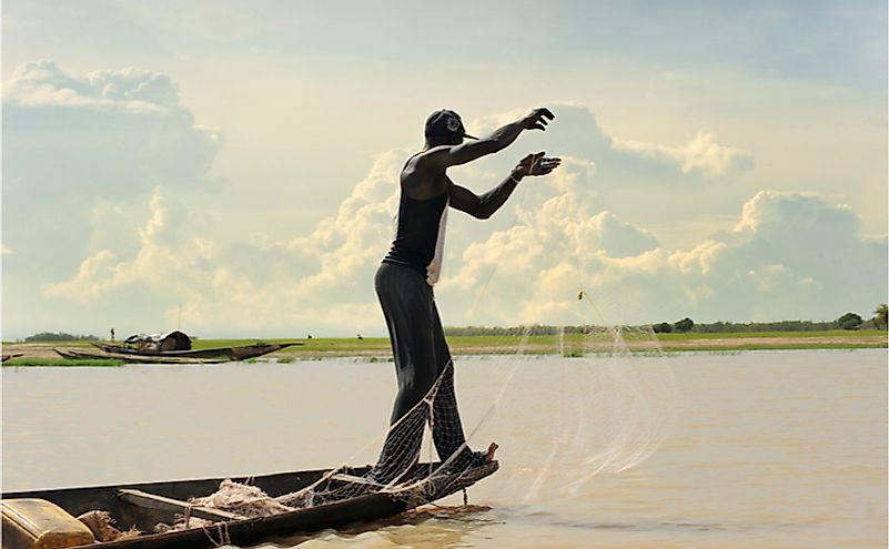 Fishermen fishing on River Niger, the river from where the country derived its name.