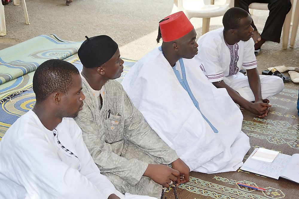 Men in a mosque in the Ivory Coast. Editorial credit: vystekimages / Shutterstock.com. 