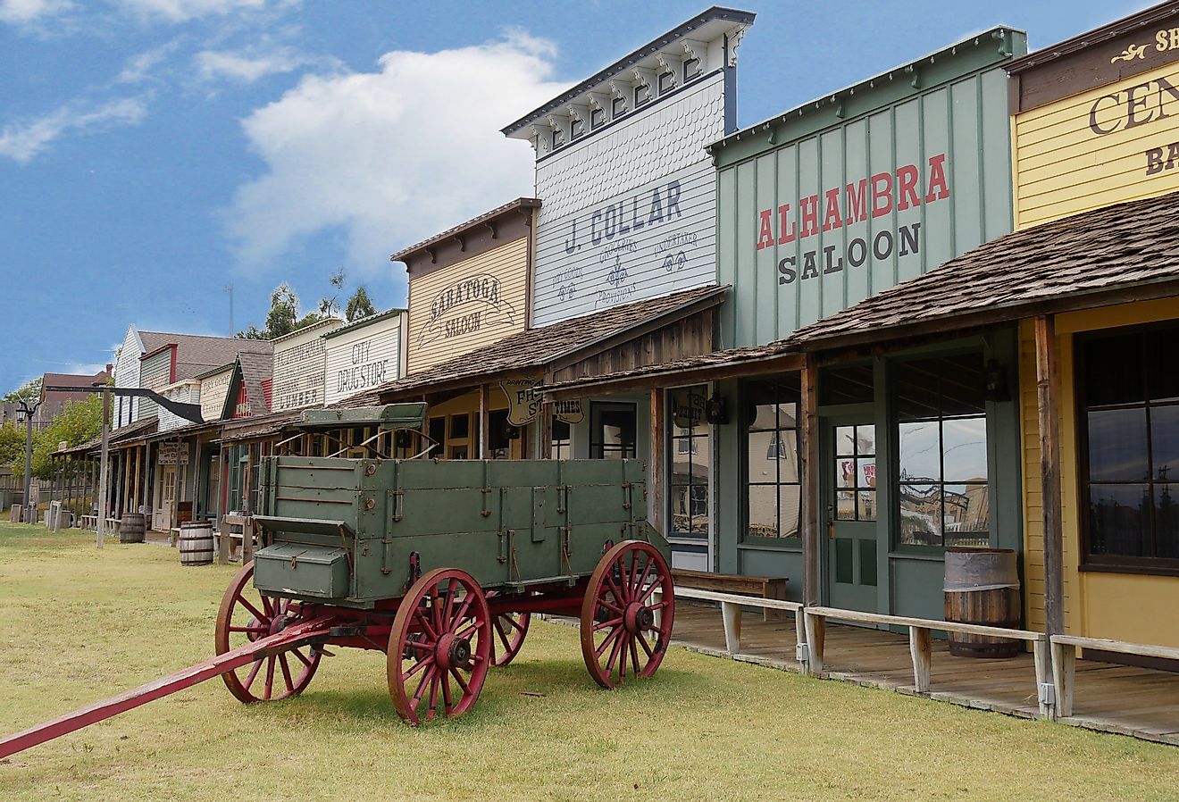 Façade of the Front Street replica with an old chuck wagon at the Boot Hill historical museum in Dodge City, Kansas. Image credit RaksyBH via Shutterstock
