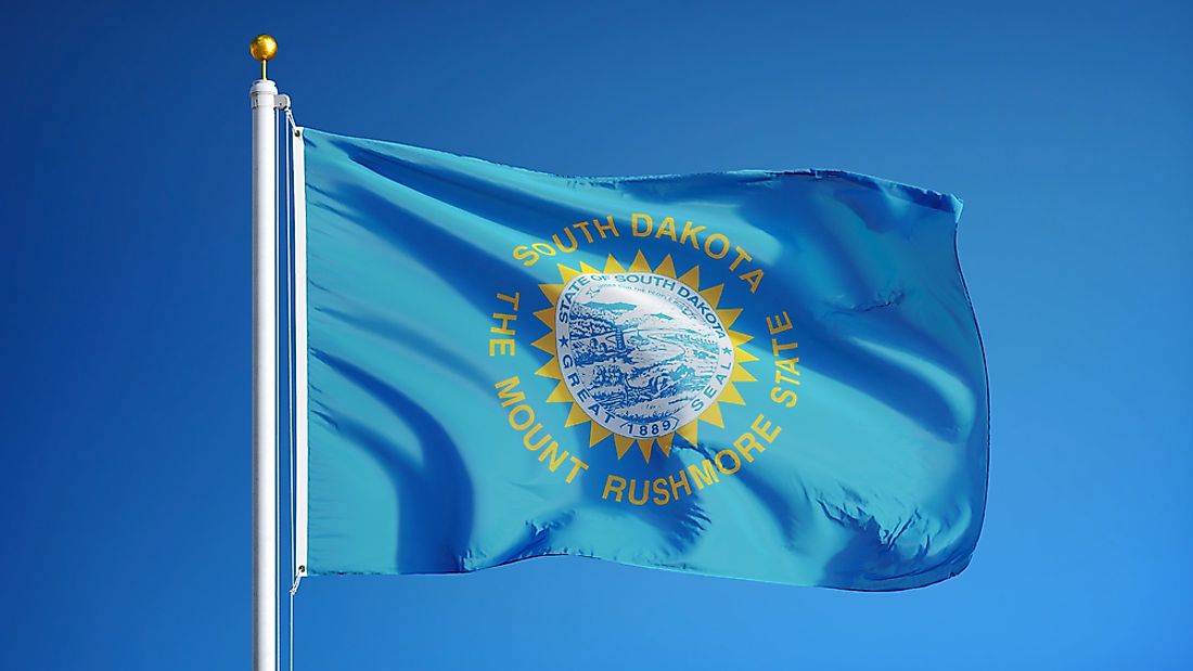 The South Dakota state flag features the state seal inside a yellow sun.