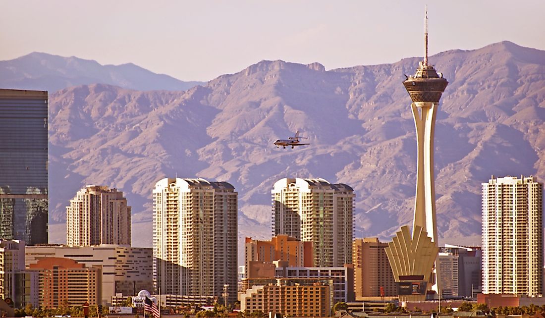 View of downtown Las Vegas flanked by mountain.