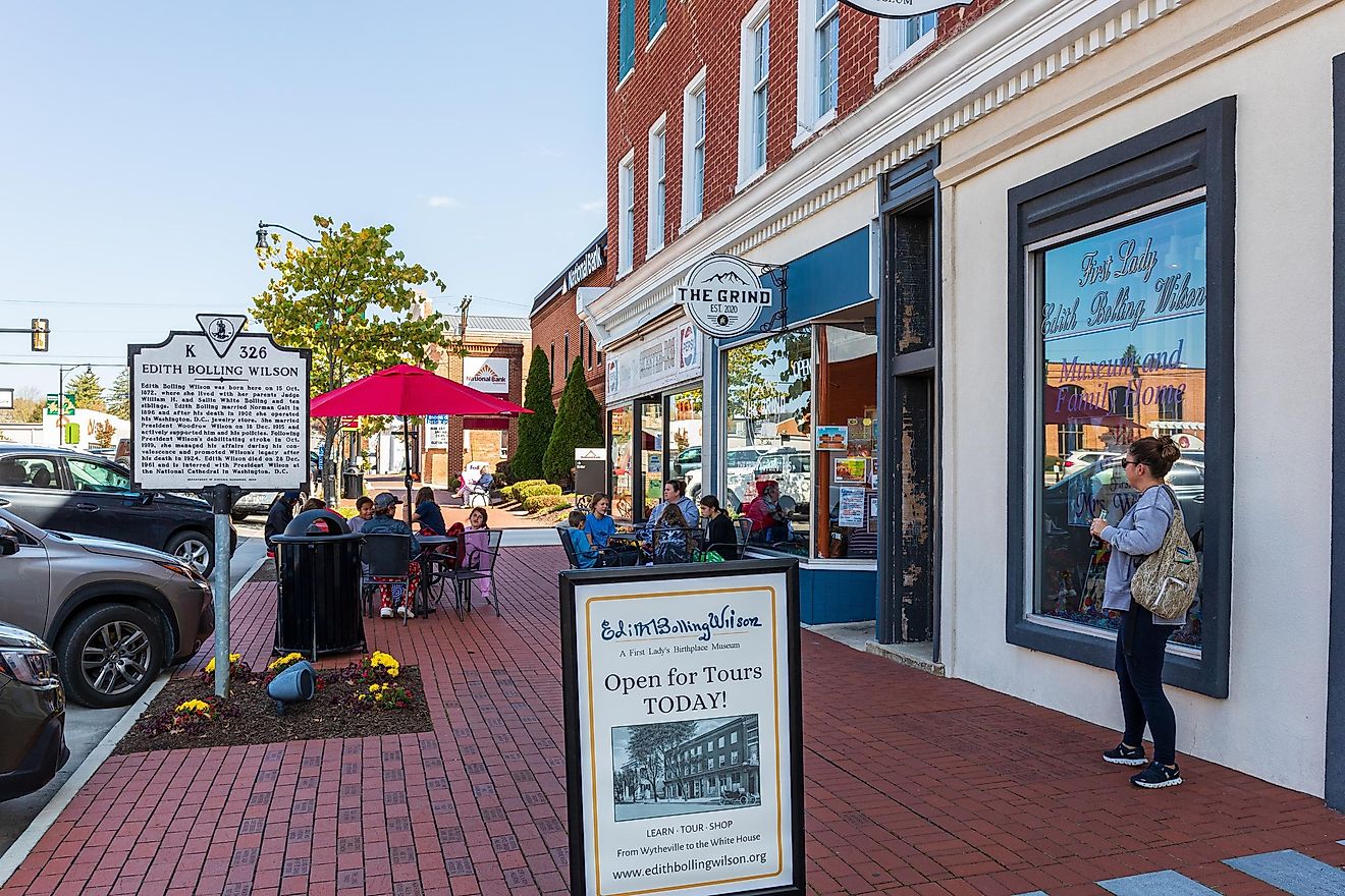 Wytheville, Virginia: Sidewalk showing the Edith Bolling Wilson Museum, The Grind Coffee Shop and Skeeter's restaurant, with multiple sidewalk diners, via Nolichuckyjake / Shutterstock.com