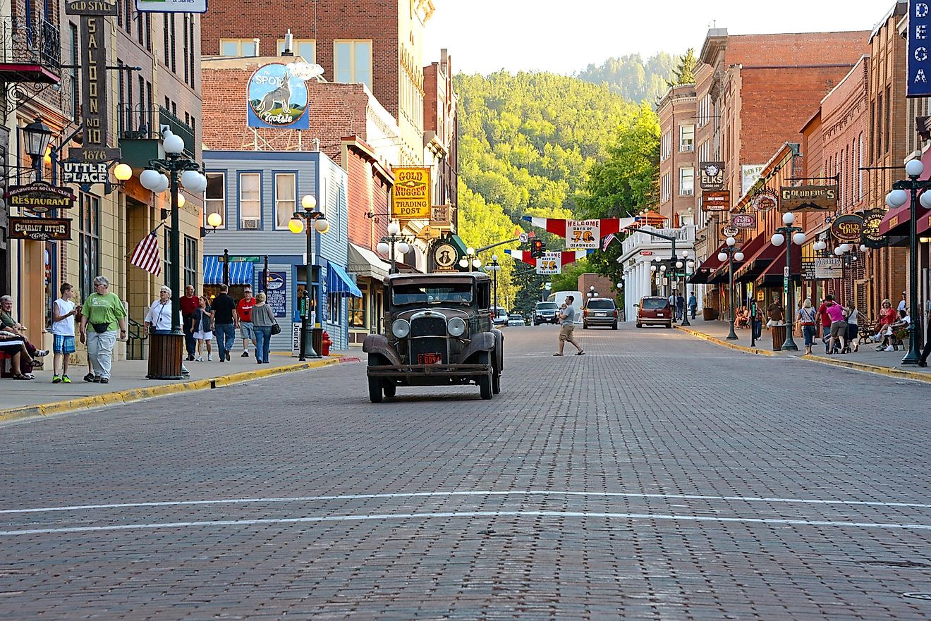 Deadwood, South Dakota, 07/10/2013 vintage car approaching on main street in Deadwood