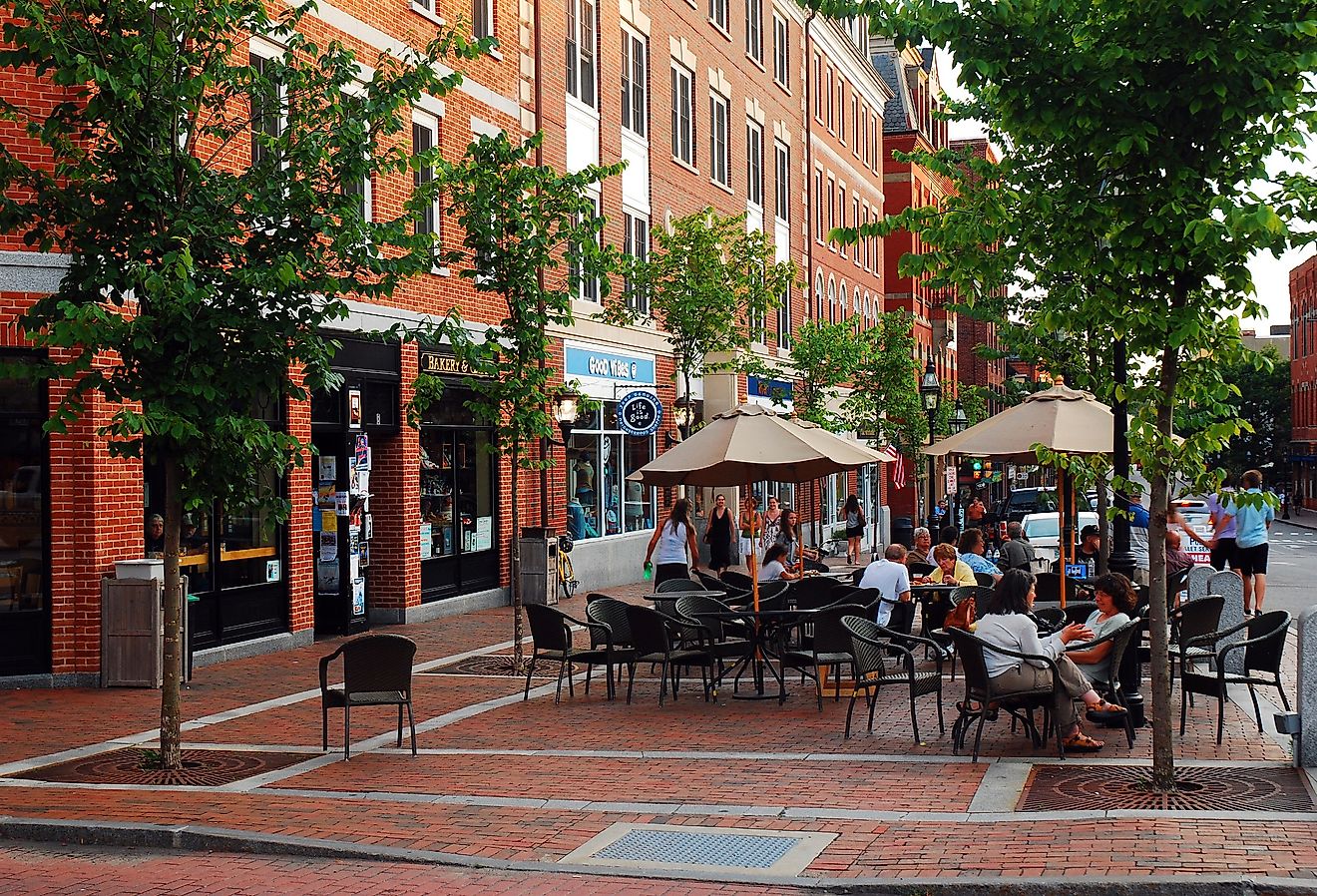 Folks enjoy a warm summer day at an outdoor café in Portsmouth, New Hampshire. Image credit James Kirkikis via Shutterstock