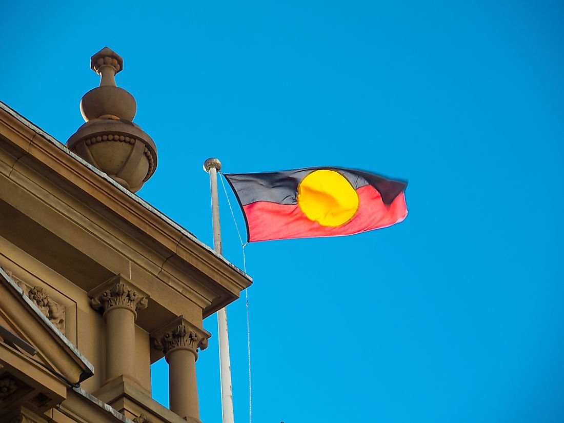 The Australian Aboriginal flag flying at Sydney City Hall. Editorial credit: ArliftAtoz2205 / Shutterstock.com.