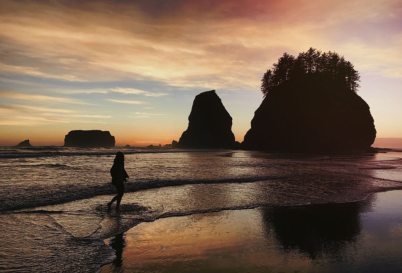 Silhouette of woman on La Push Beach, Washington, United States.