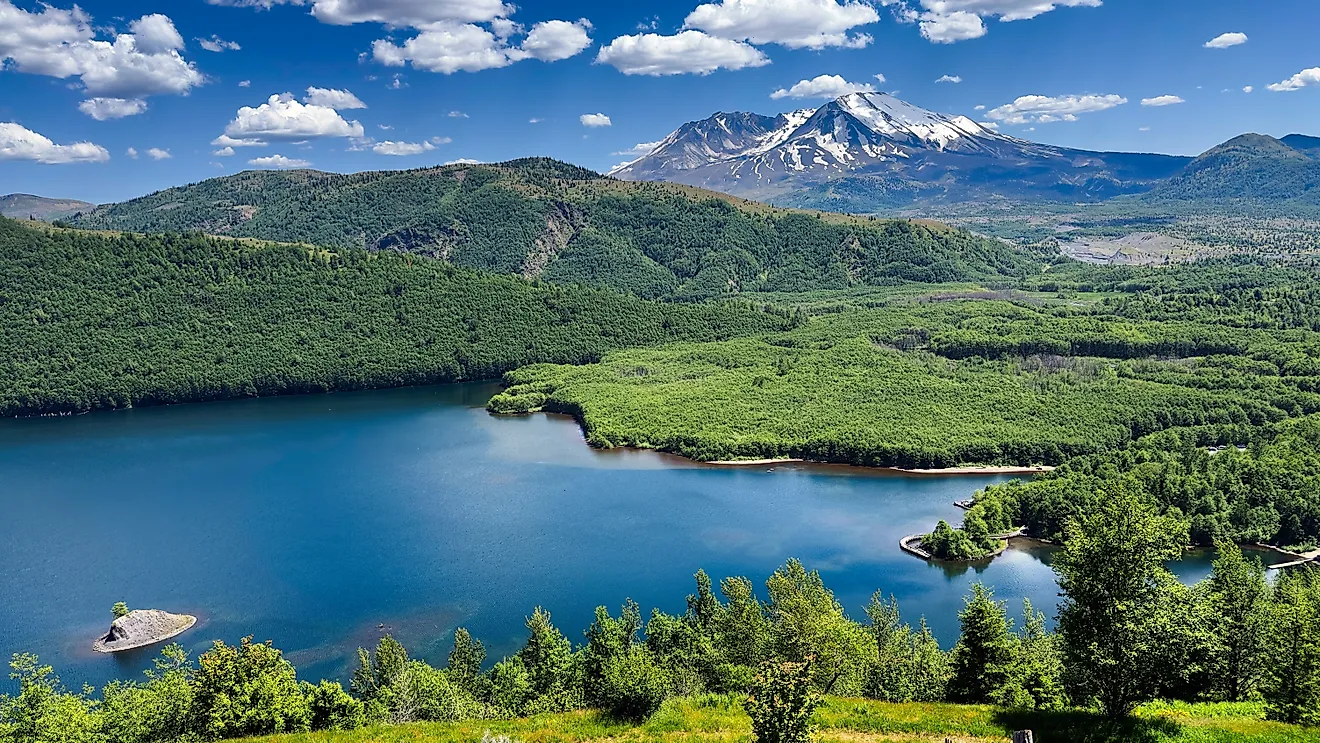 Mount St. Helens looms above Coldwater Lake in southern Washington, a lake that was formed during the 1980 eruption.