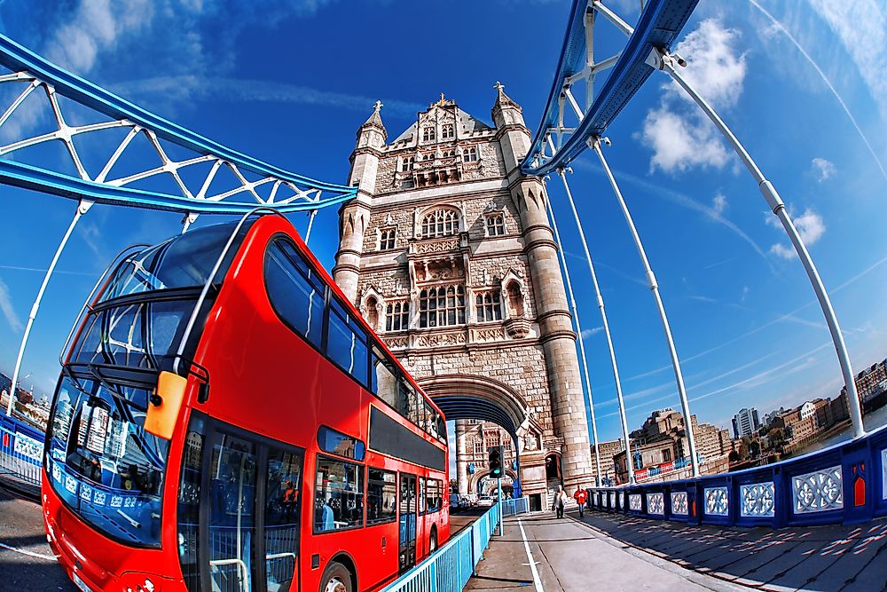 A tour bus passes over the River Thames on the famous Tower Bridge. 