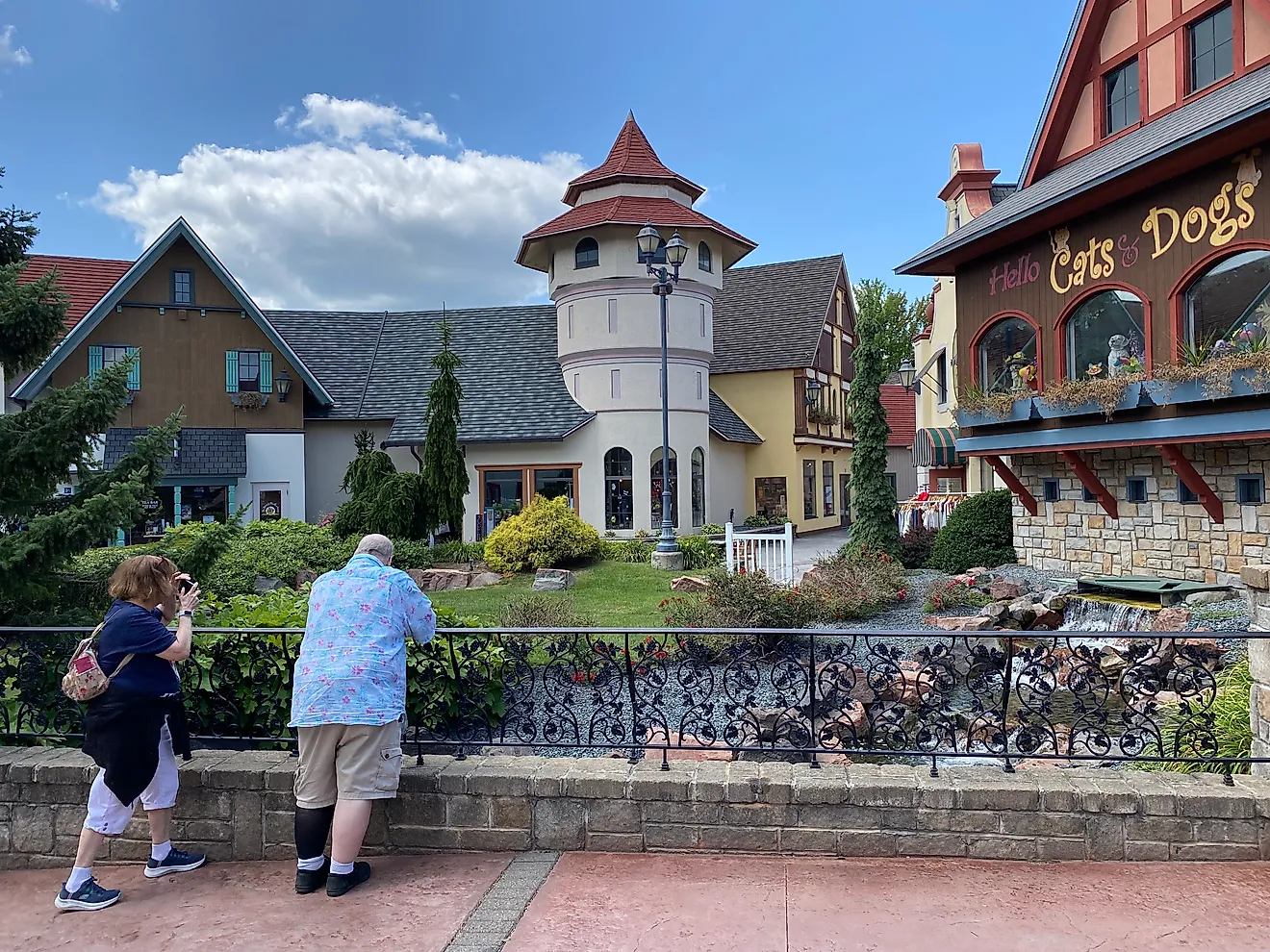 A couple of fellow tourists admiring the manicured naturescape and Bavarian architecture within Frankenmuth’s River Place Shops. Photo credit: Andrew Douglas