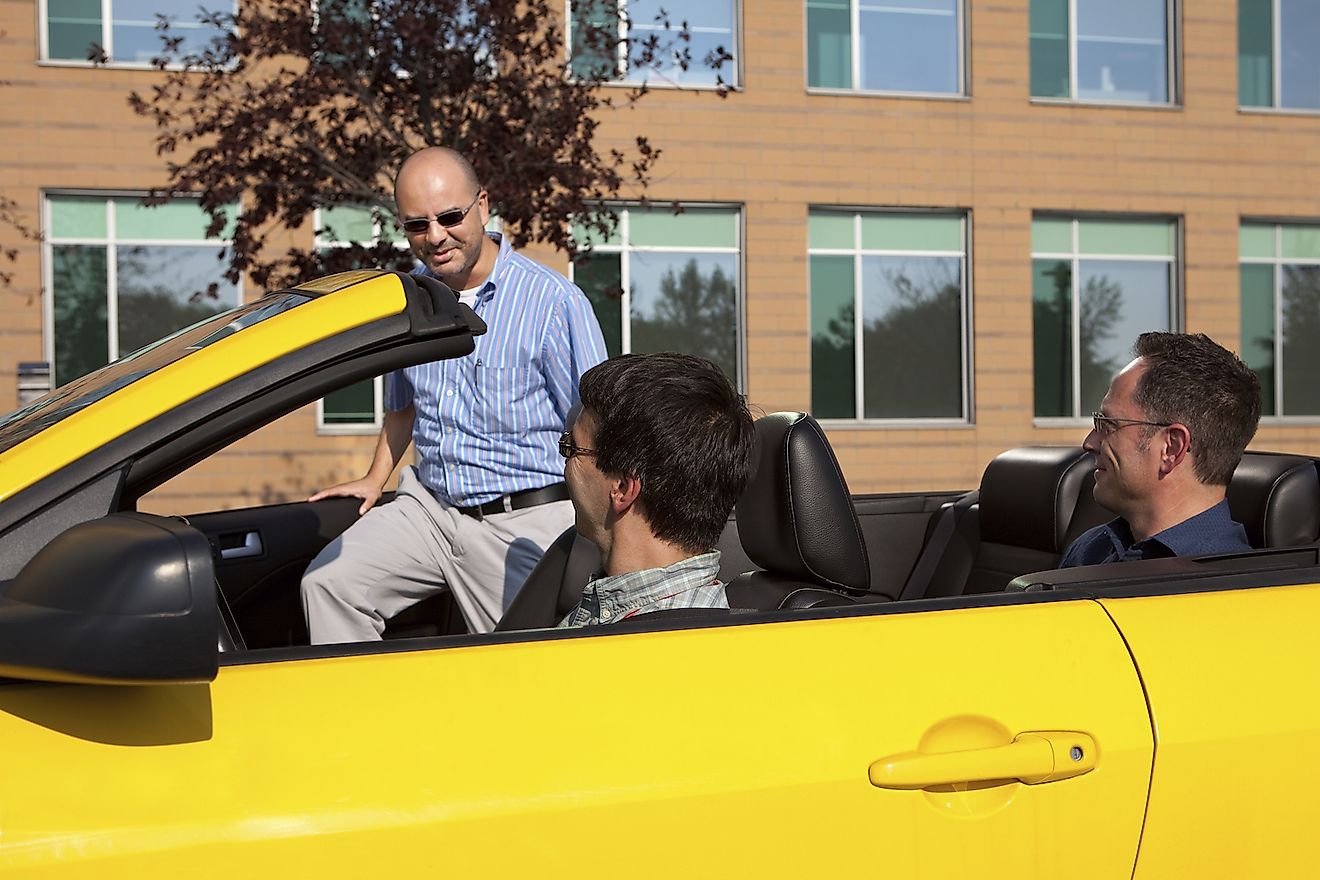 Work colleagues car pooling from the office. Image credit: Paul Vasarhelyi/Shutterstock.com