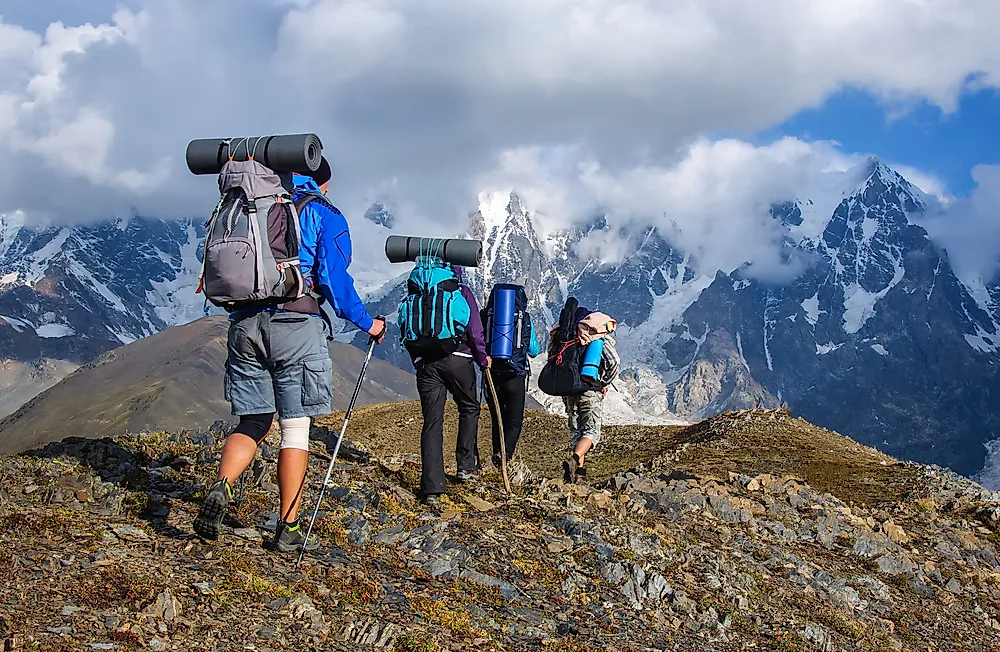 Tourists hiking in the mountains of Georgia. 