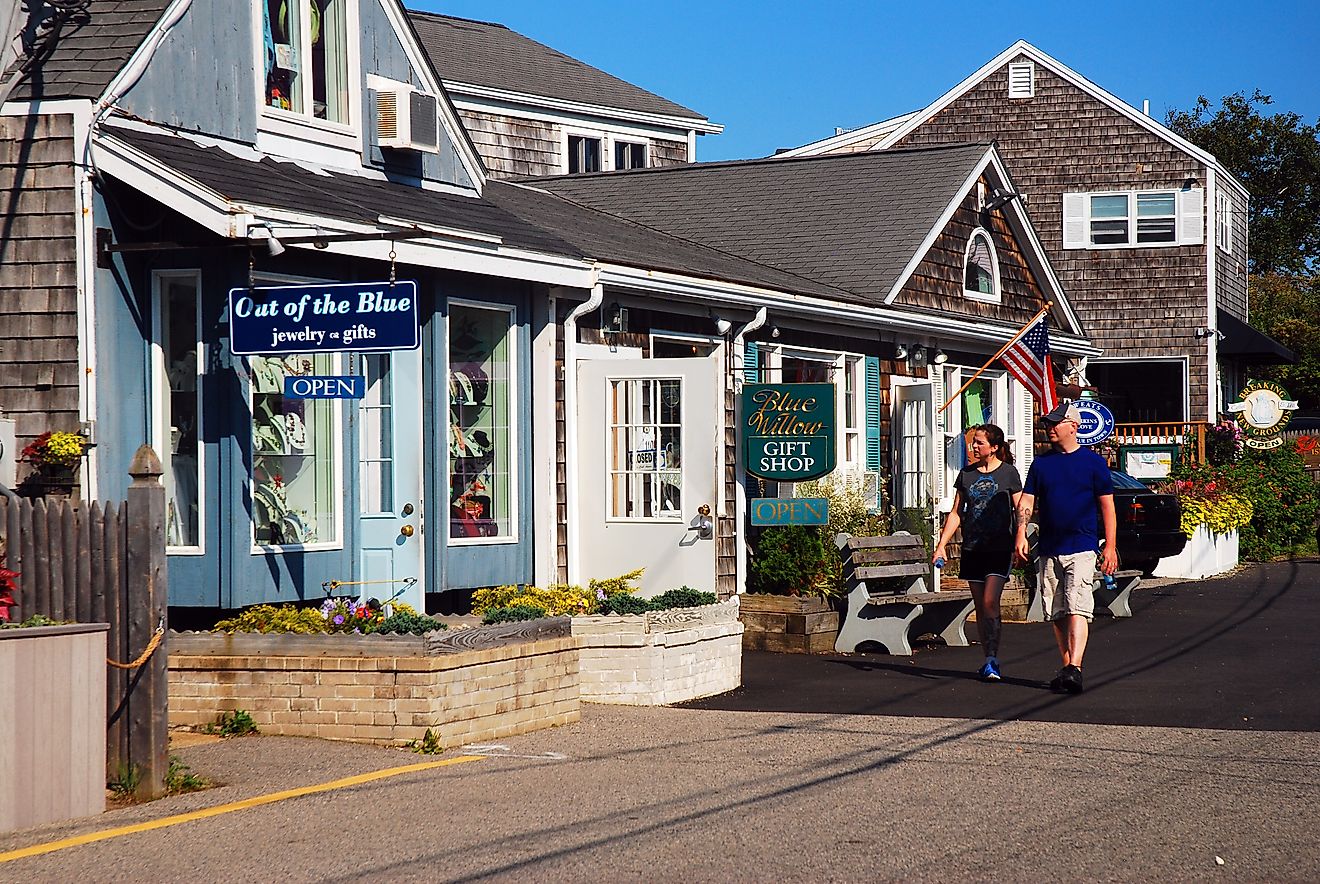 A couple browsing the small boutique stores of Perkins Cove in Ogunquit, Maine, USA. Editorial credit: James Kirkikis / Shutterstock.com