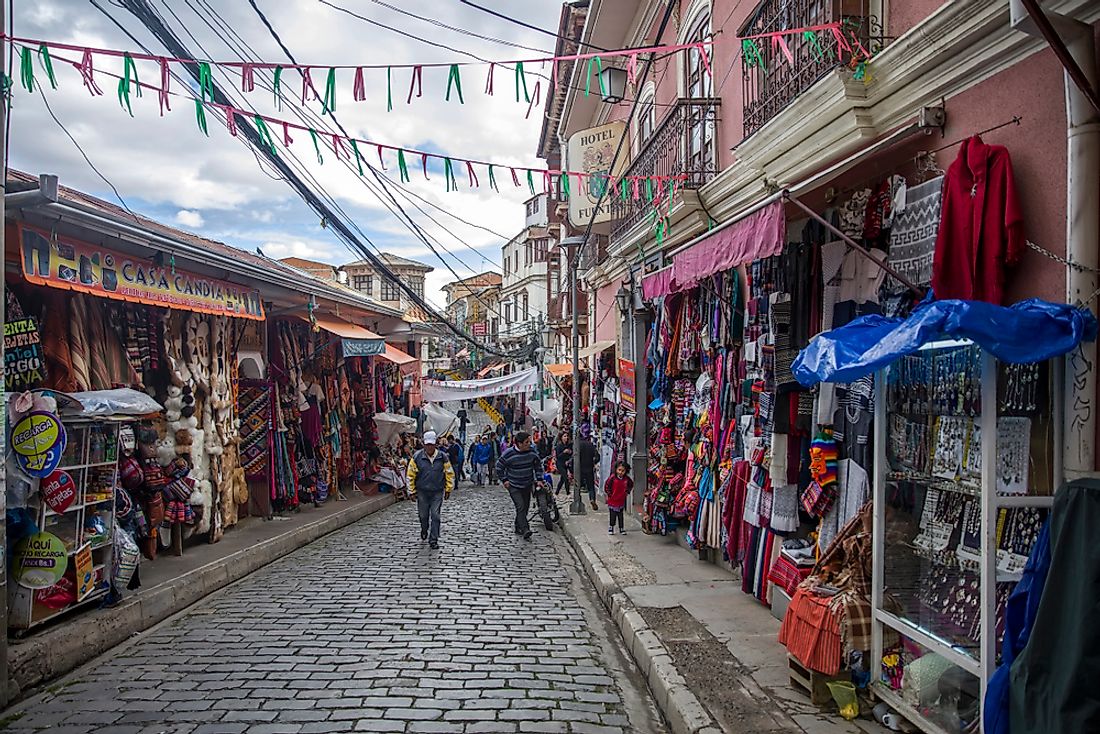 People walk on the streets of La Paz, Bolivia. Bolivia reports the lowest incomes out of any South American country. Editorial credit: Goran Bogicevic / Shutterstock.com.