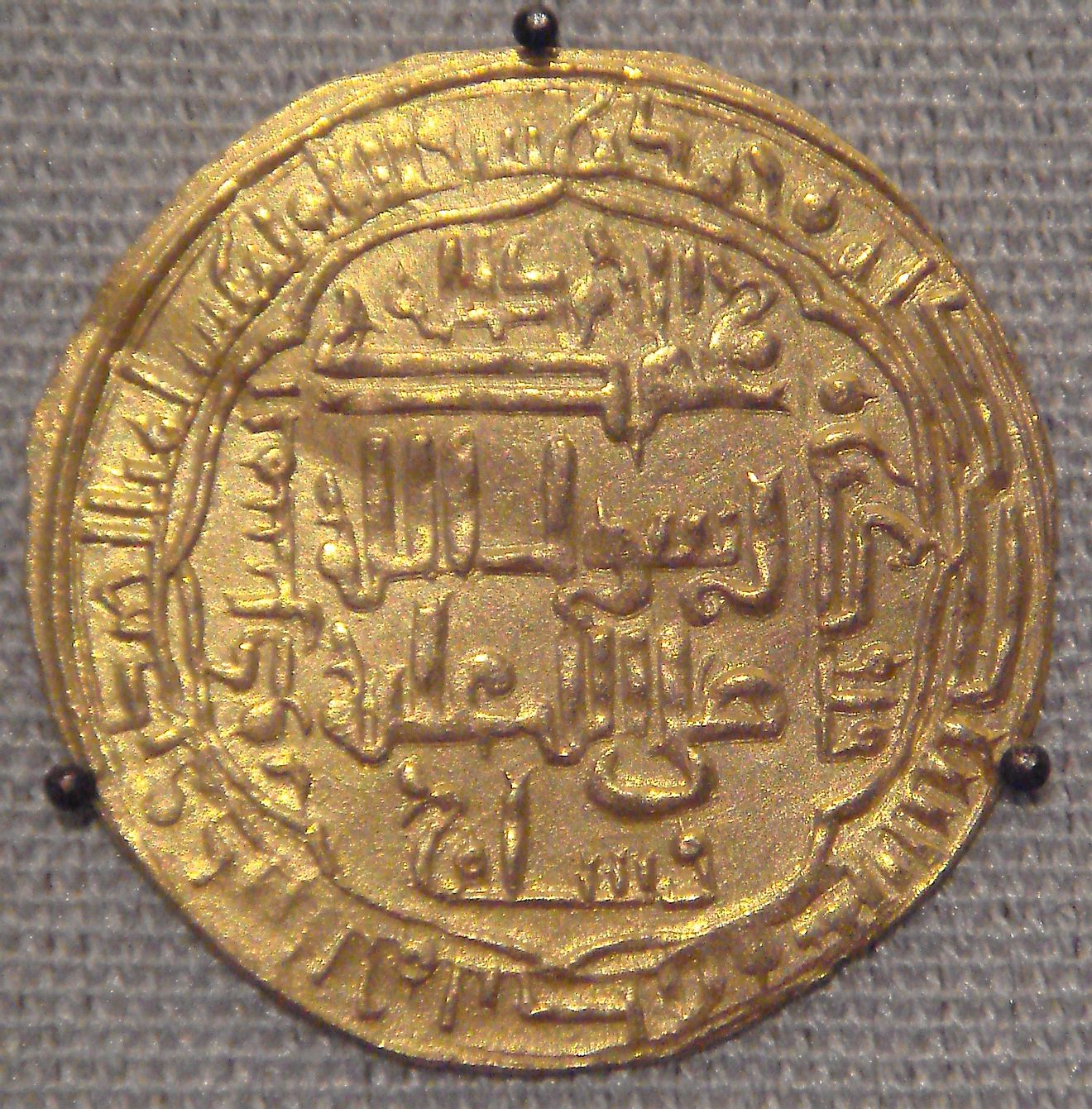A gold coin belonging to the Abbasid Caliphate.