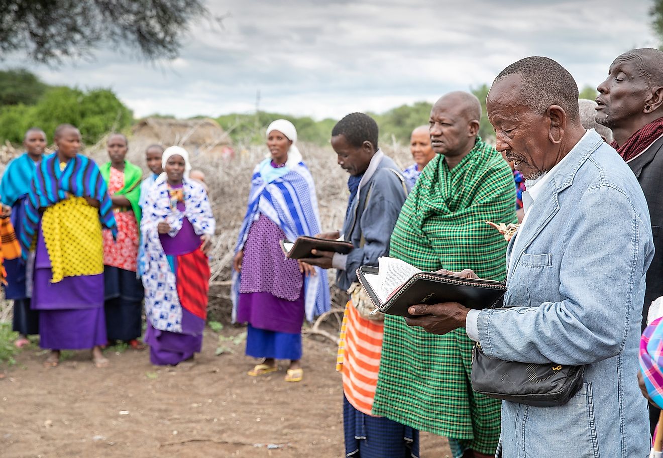 A group of Tanzanians observing a Christian religious ceremony. Image credit: Katiekk/Shutterstock.com