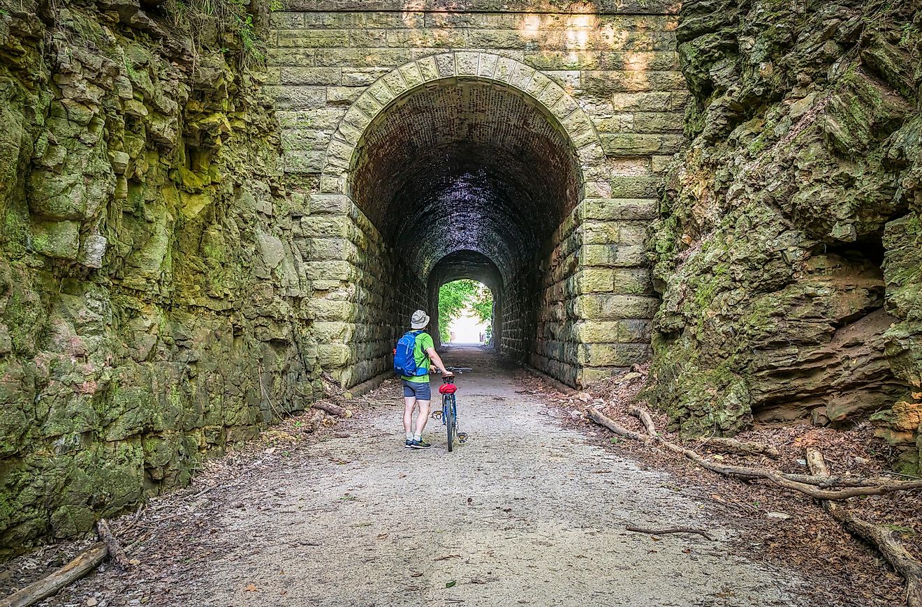 Male cyclist at MKT tunnel on Katy Trail near Rocheport, Missouri. 