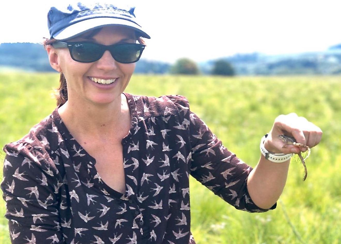 Dr. Jeanne Tarrant holding a river frog.