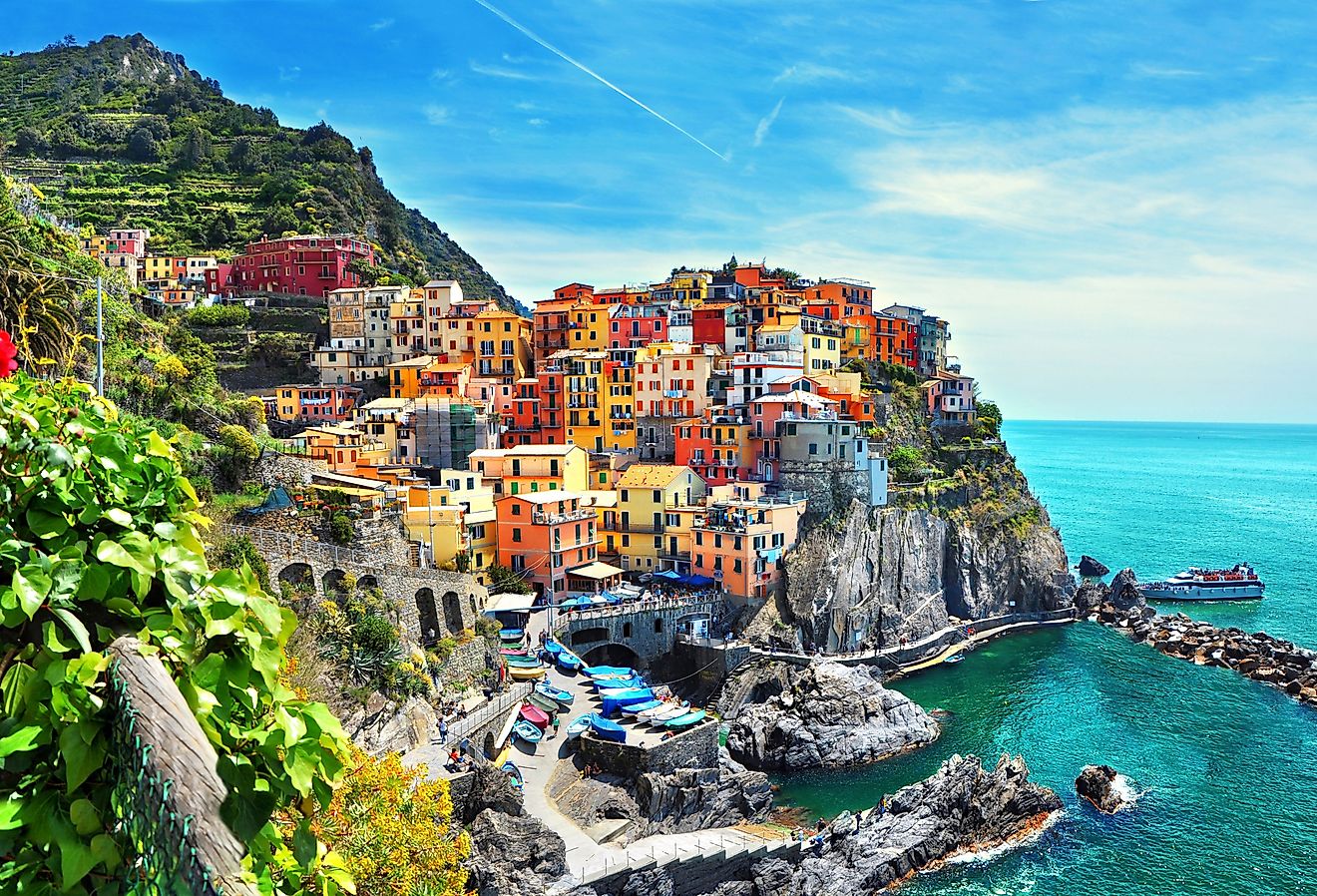 Beautiful view of Manarola town, one of five famous colorful villages of Cinque Terre in Italy. Image credit: Minoli via Shutterstock 