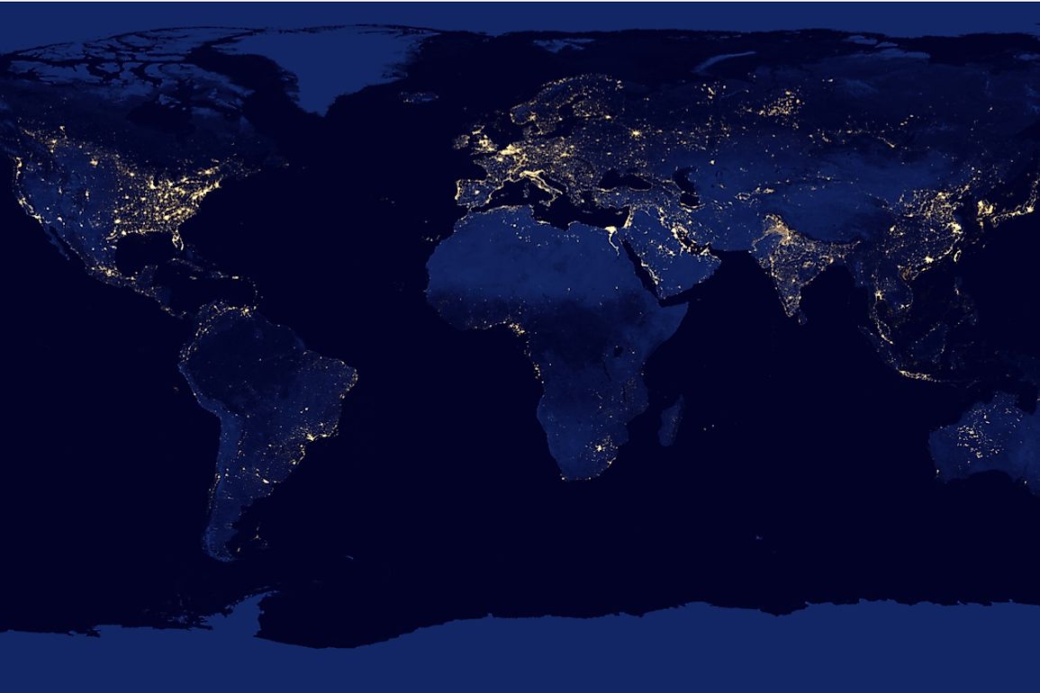 City lights illuminating the view of Earth at night from space. 