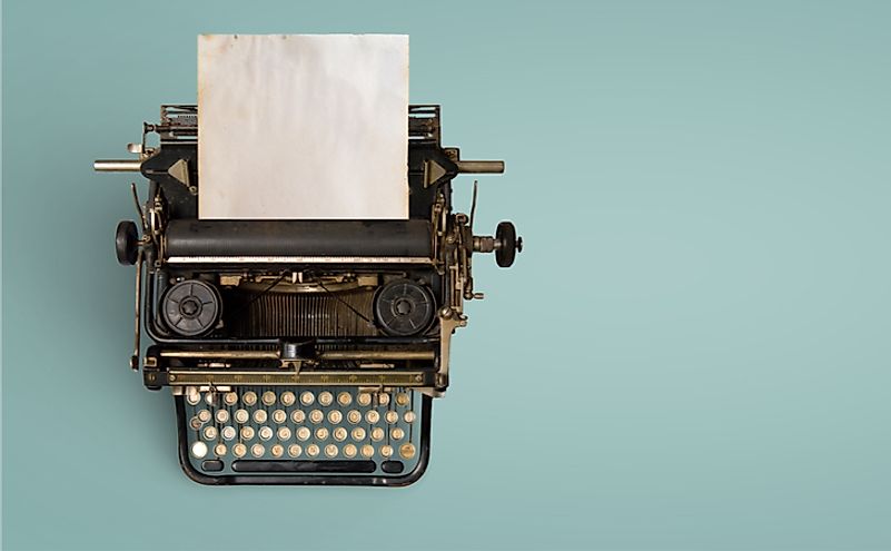 Vintage typewriter header with old paper. retro machine technology.