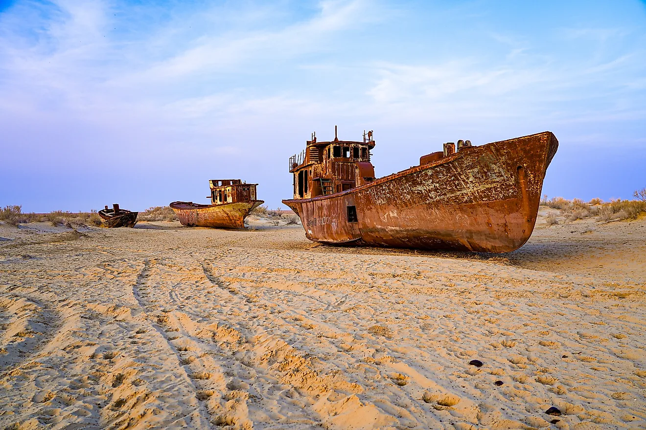 Rusty shipwreck lying on the seabed of the dried-up Aral Sea in Moynaq (or Muynak), a former fishing town in Karakalpakstan, Uzbekistan